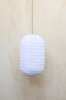 A white linen shade designed for pendant lighting, displayed against a neutral background.